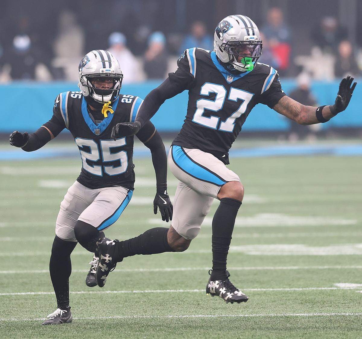 Carolina Panthers Isaiah Simmons, right, breaks down the field to assist on a kickoff on Nov. 30, 2025, at Bank of America Stadium in Charlotte. The Panthers defeated the Rams 31-28.