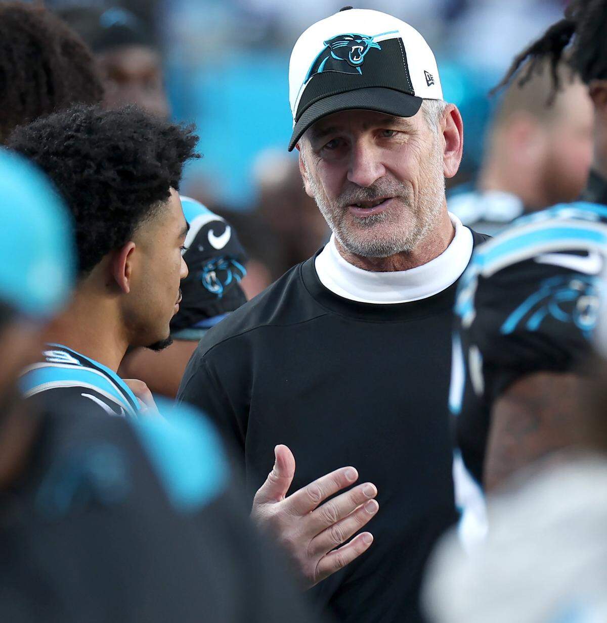 Carolina Panthers quarterback Bryce Young, left and head coach Frank Reich, right, talk along the team’s bench during second half action at Bank of America Stadium in Charlotte, NC on Sunday, November 19, 2023. The Dallas Cowboys defeated the Panthers 33-10. Reich was fired later in the month, after the Panthers started 1-10.