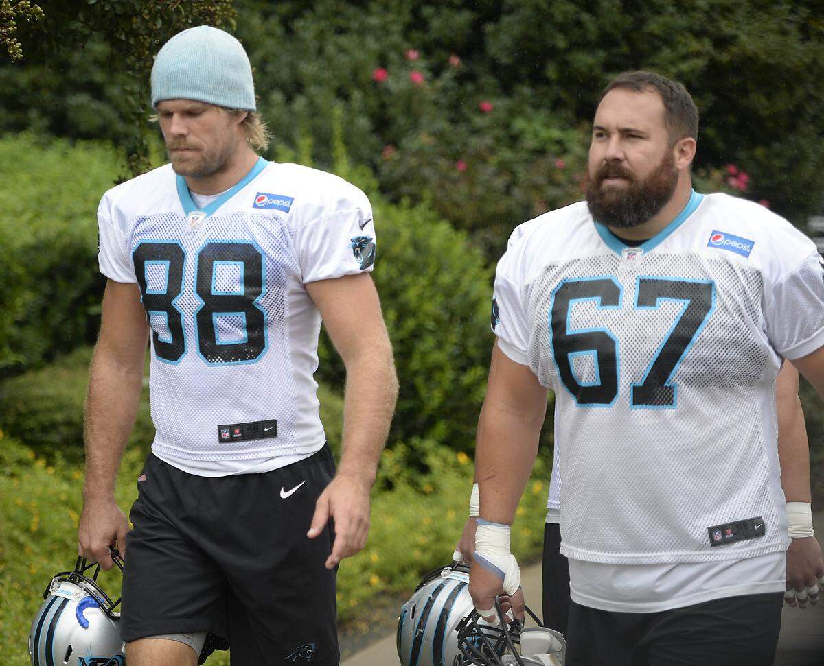 Carolina Panthers tight end Greg Olsen (88) walks into practice with center Ryan Kalil (67) at the team’s practice facility on Wednesday, October 10, 2018.