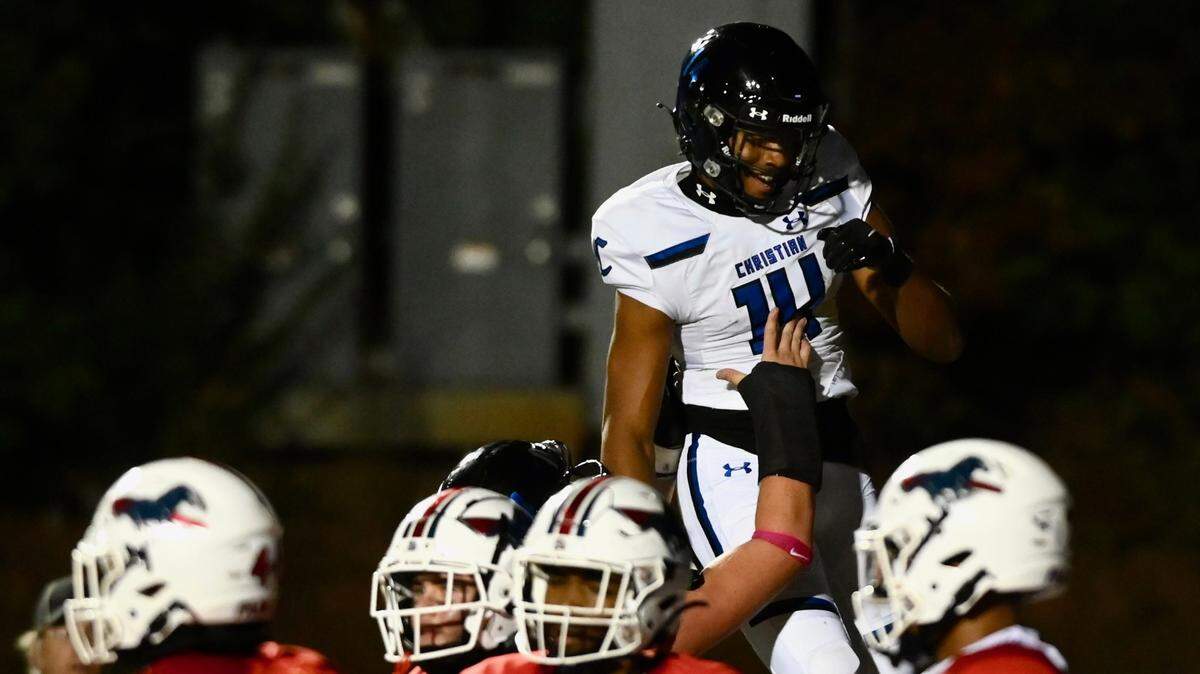 Charlotte Christian’s Micah Gilbert is lifted into the air following a touchdown pass reception during first quarter action against Providence Day on Friday, October 14, 2022. Jeff Siner/The Charlotte Observer
