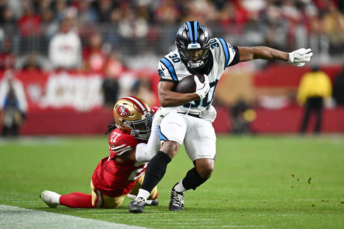 Carolina’s Chuba Hubbard is tackled by San Francisco’s Ji’Ayir Brown during the fourth quarter of Monday’s game at Levi’s Stadium.