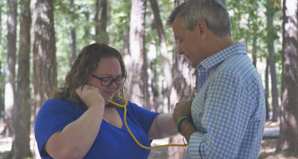 Vannessa Blais listening to the heart her brother Daniel donated to Steve Hilfiker.