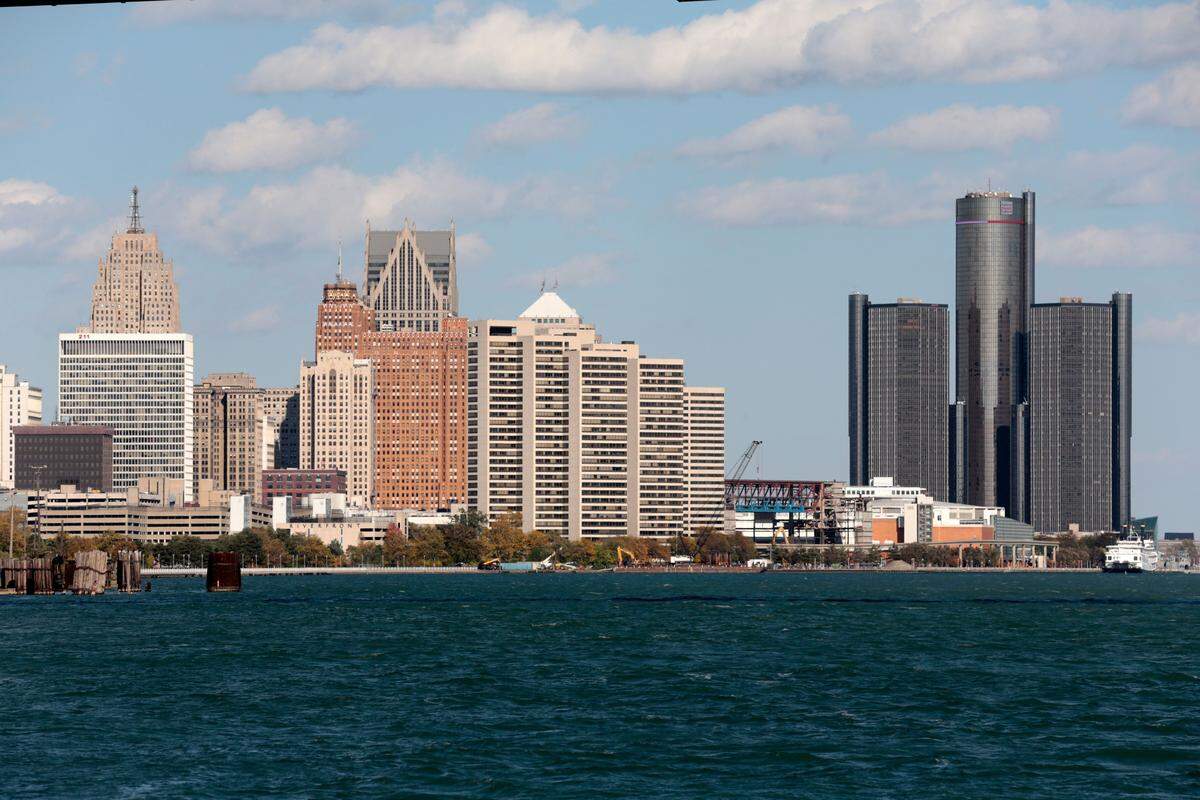 The Detroit skyline seen from Riverside Park in Detroit, Michigan, on October 23, 2019. - Sims is co-founder of the nonprofit Project We Hope, Dream, and Believe, a youth mentoring organization and hopes to restore the home. Outside the dilapidated home where Malcolm X once lived, Aaron Sims hesitates before confiding that he voted for Donald Trump. In majority-black Detroit, and nationwide, African-Americans overwhelmingly support Democrats. But in 2016 their voter participation dropped, and with next year's presidential election looming, their enthusiasm has yet to return. (Photo by JEFF KOWALSKY / AFP) (Photo by JEFF KOWALSKY/AFP via Getty Images)