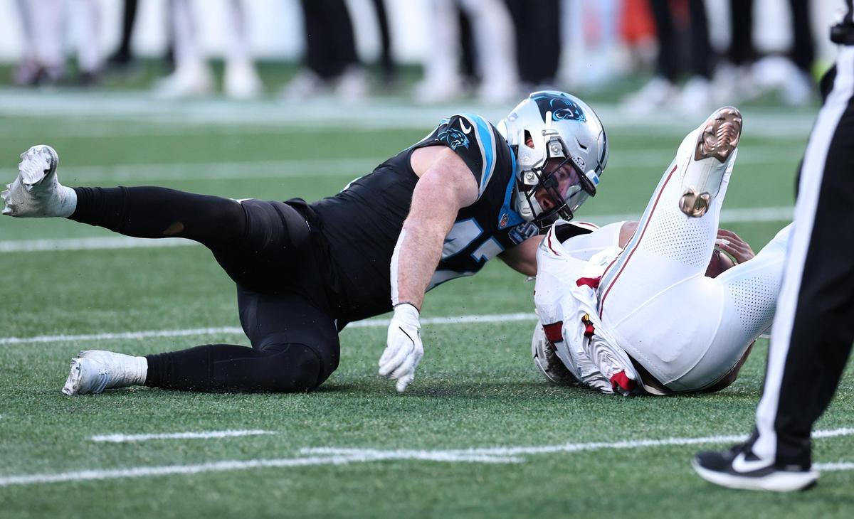 Carolina Panthers linebacker Josey Jewell, left, sacks Arizona Cardinals quarterback Kyler Murray, right, during action at Bank of America Stadium in Charlotte, NC on Sunday, December 22, 2024. The Panthers defeated the Cardinals 36-30 in overtime.