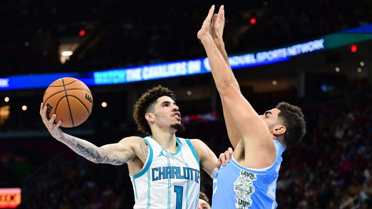 Charlotte Hornets guard LaMelo Ball (1) drives to the basket against Cleveland Cavaliers forward Georges Niang (20) during the first half at Rocket Mortgage FieldHouse.