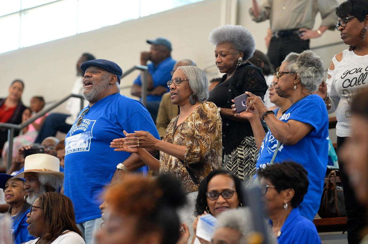 Second Ward High School alumni dance and cheer during the 50th anniversary of the closing of the school at the Second Ward High School Gymnasium and Museum on Saturday, June 1, 2019. After the school closed its doors in 1969, it was bulldozed as part of urban renewal and the destruction of the Brooklyn neighborhood.