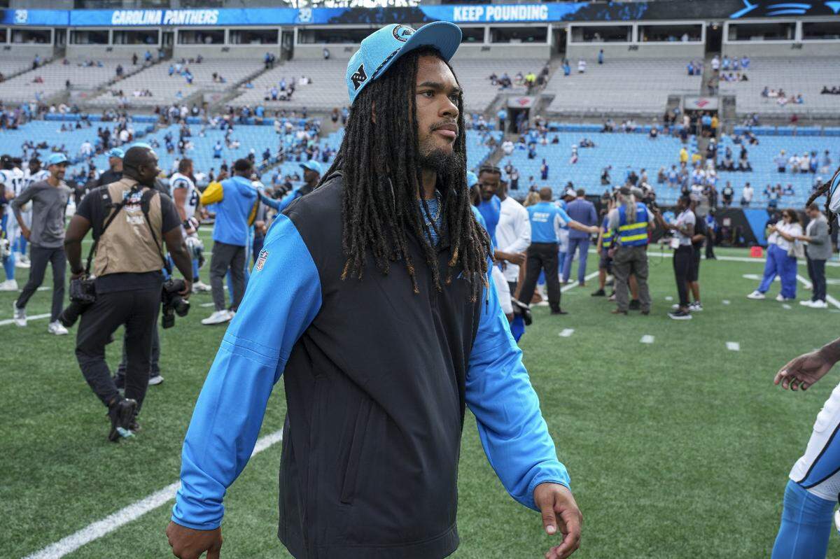 Sep 15, 2024; Charlotte, North Carolina, USA; Carolina Panthers running back Jonathon Brooks (24) walks off the field after the second half against the Los Angeles Chargers at Bank of America Stadium. Mandatory Credit: Jim Dedmon-Imagn Images