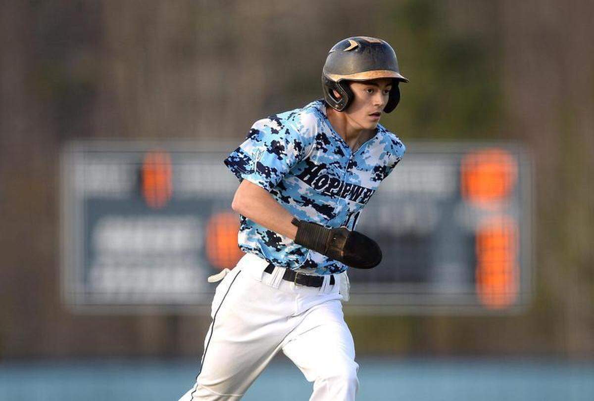 Hopewell Titans Jordan Brooks runs home for the team’s first run during action against West Charlotte on Tuesday, March 22, 2022 at Hopewell High School in Huntersville, NC.