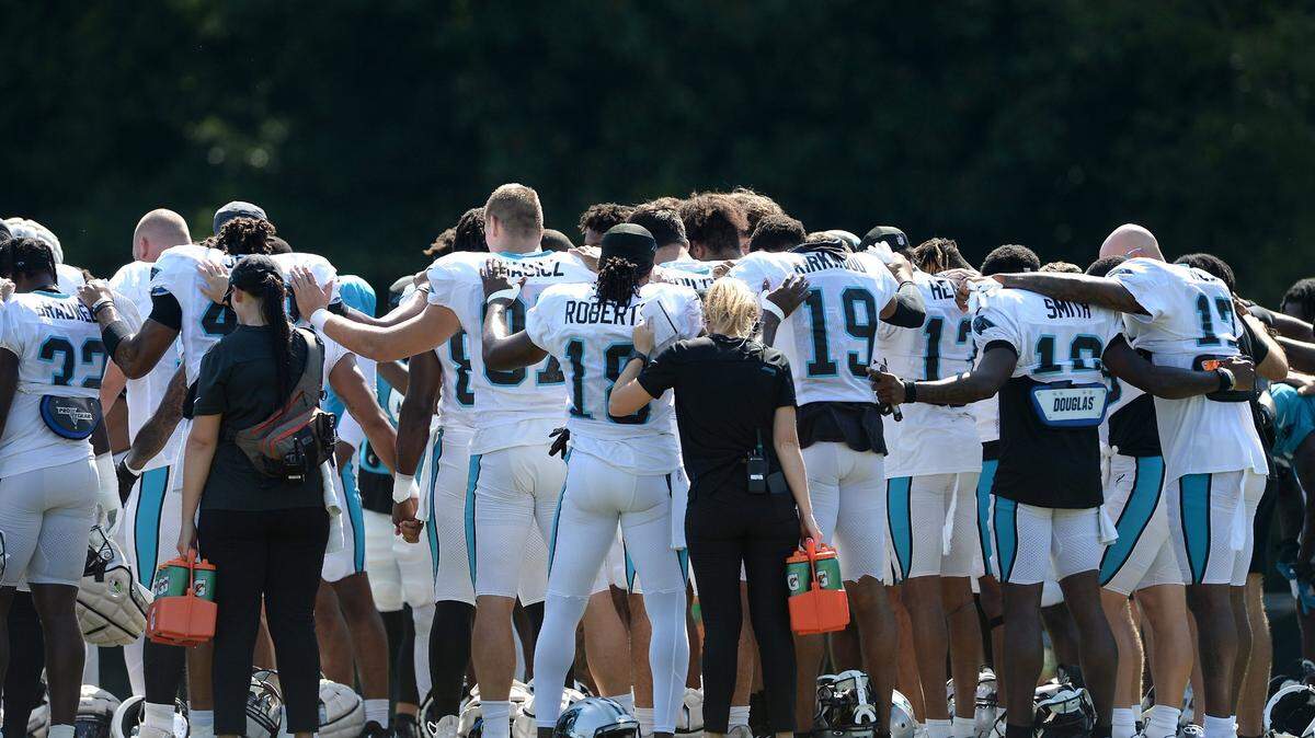 The Carolina Panthers gather in prayer prior to the start of practice on Monday, August 8, 2022 at Wofford College in Spartanburg, SC.