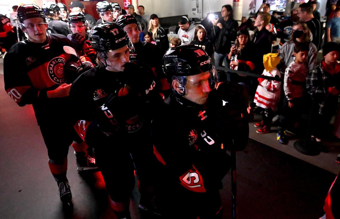 The Charlotte Checkers line up to be introduced at Bojangles Coliseum in Charlotte, NC on Friday, October 18, 2024. The Charlotte Checkers hosted the Cleveland Monsters in the home opener.