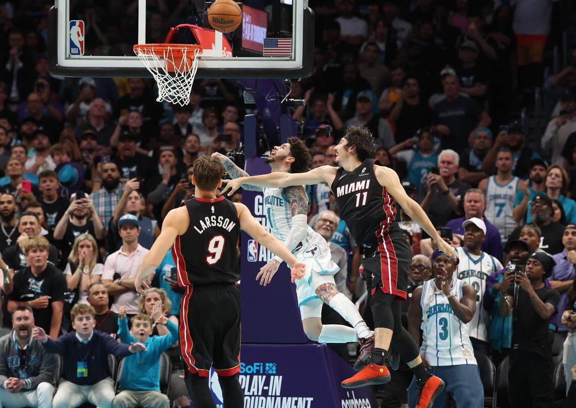 Charlotte Hornets guard LaMelo Ball drives to the basket for the game winning basket as Miami Heat forward Jaime Jaquez Jr., right, attempts a stop at Spectrum Center in Charlotte, NC on Tuesday, April 14, 2026. The Hornets defeated the Heat 127-126 in NBA Play-in-Tournament basketball game.