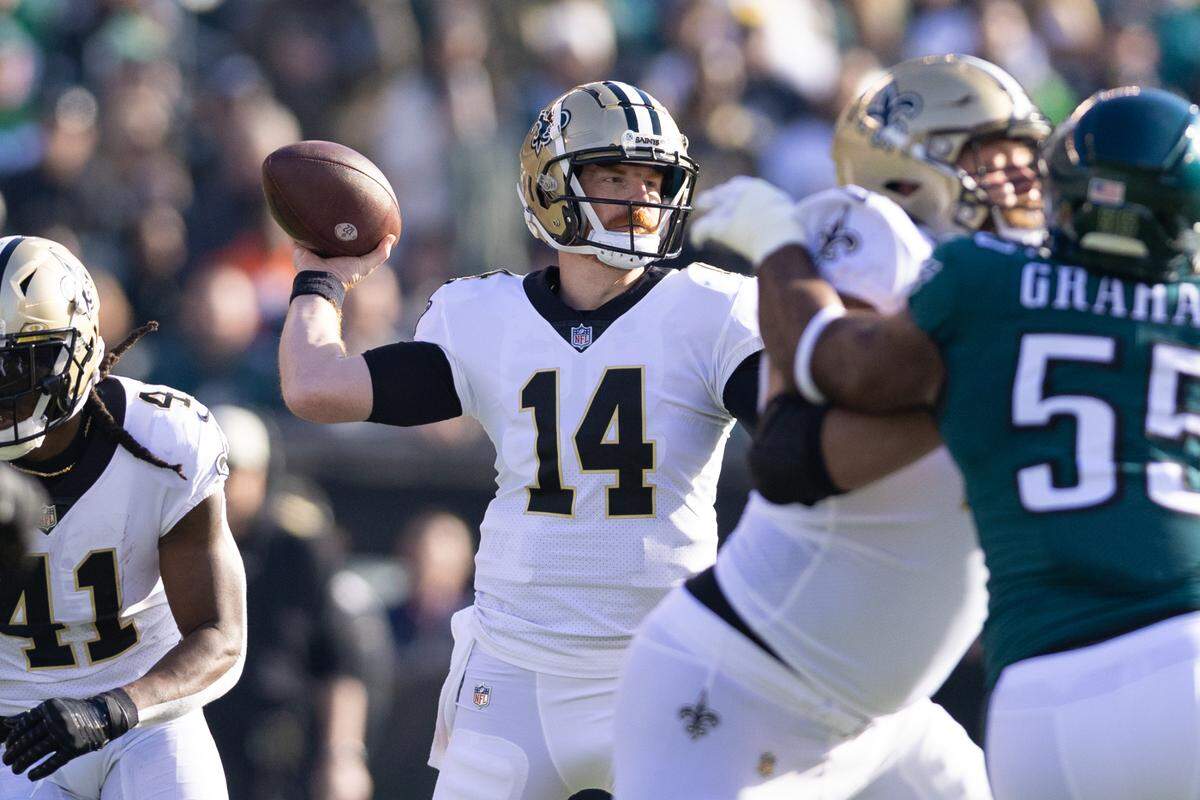 New Orleans Saints quarterback Andy Dalton (14) passes the ball against the Philadelphia Eagles during the first quarter at Lincoln Financial Field.