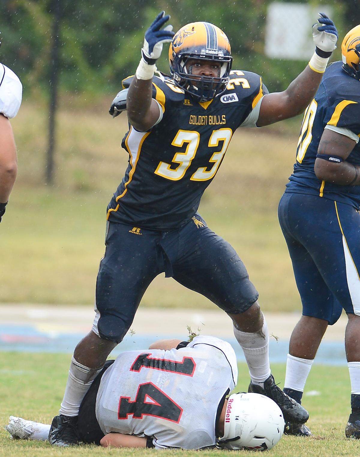 Golden Bulls defensive lineman Jovontay Williams celebrates sacking Davidson quarterback Jonathan Carkhuff at Johnson C. Smith University in Charlotte, NC, in September 2013. Williams died while in custody at a hospital on Monday, June 13, 2022.