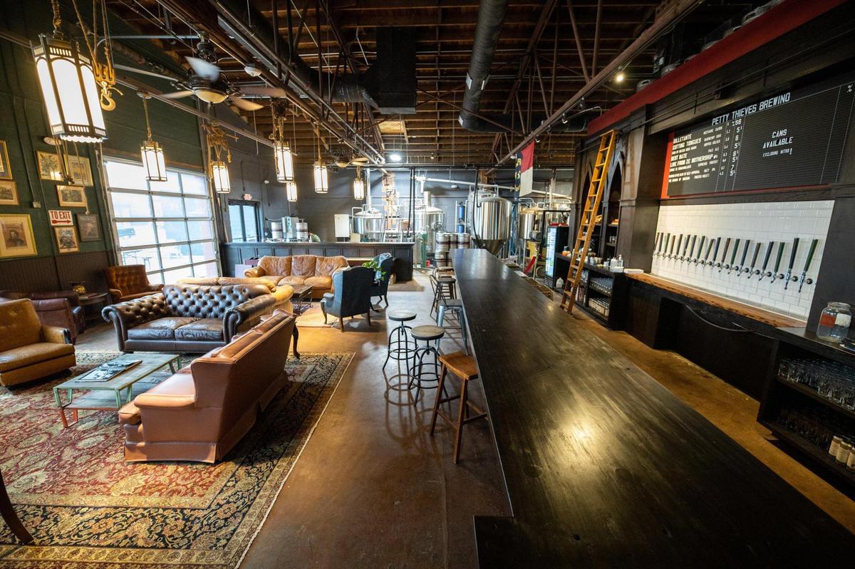 Multiple taps line the back of the bar at Petty Thieves Brewery.