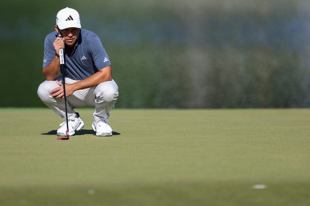 Xander Schauffele eyes the seventeenth hole before putting on Thursday, May 4, 2023 during the first round of the Wells Fargo Championship at Quail Hollow Club.