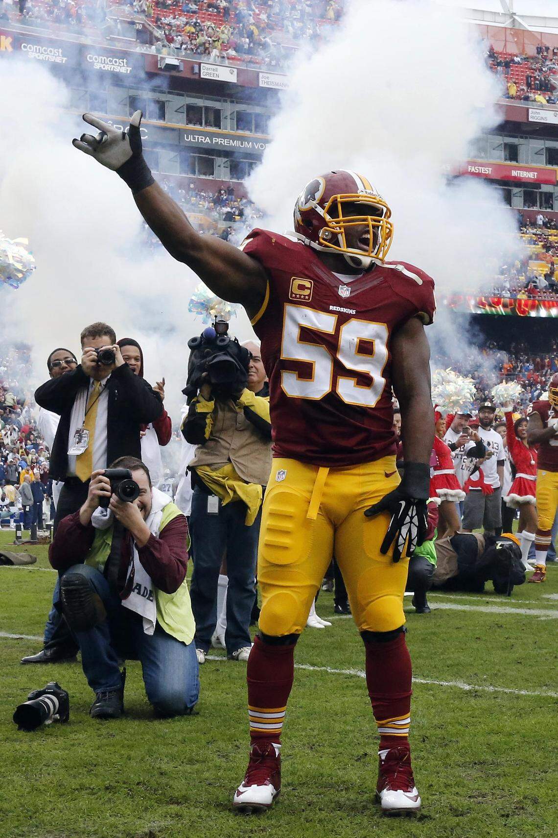 Washington Redskins inside linebacker London Fletcher (59) is introduced prior to a 2013 game against the Dallas Cowboys at FedEx Field. 