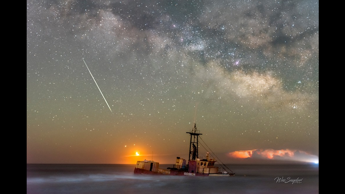 Photographer Wes Snyder captured a series of celestial photos of the shipwreck off Cape Hatteras National Seashore. The Milky Way is clearly visible in the background.