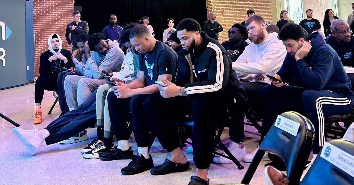 Charlotte Hornets players including LaMelo Ball (far left) await the arrival of Jeff Peterson before a news conference on Wednesday, March 6, 2024. Peterson is the team’s new director of basketball operations and its chief decision-maker on future rosters.