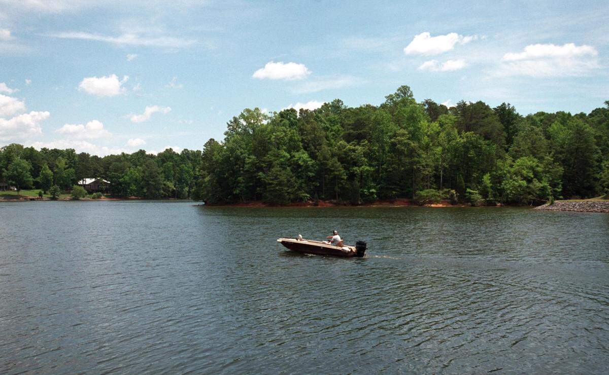 A boater on Lake Wylie cruises by the shore of Copperhead Island at McDowell Park in this Charlotte Observer file photo. The island is an undeveloped section operated by the City of Charlotte and McDowell Nature Preserve Park.