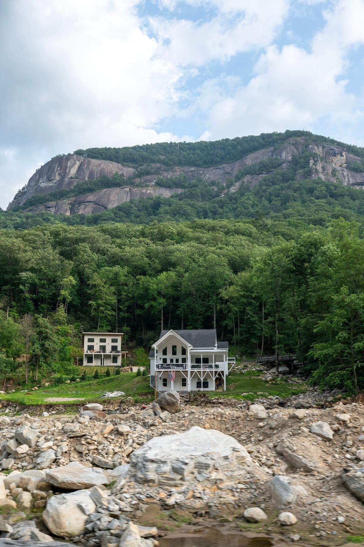 Nine months after Hurricane Helene, the Chimney Rock area has begun to rebuild, though debris remains in the river.