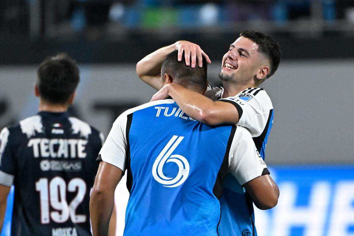 Charlotte FC defender Bill Tuiloma (6) celebrates with midfielder Nikola Petković (23) after scoring a goal in Thursday’s second half at Bank of America Stadium. 