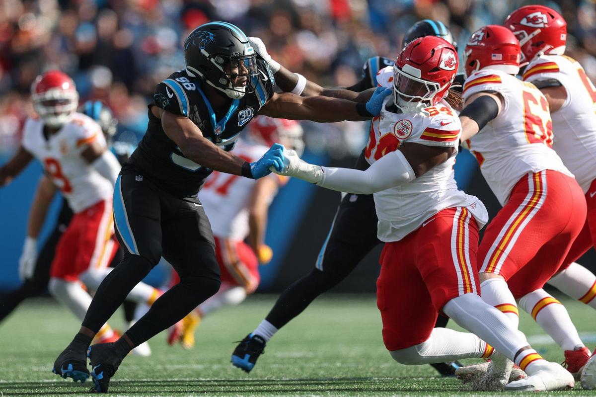 Panthers outside linebacker D.J. Wonnum, left, pushes back on Chiefs offensive lineman Wanya Morris during the game at Bank of America Stadium in Charlotte, NC on Sunday, Nov. 24, 2024.