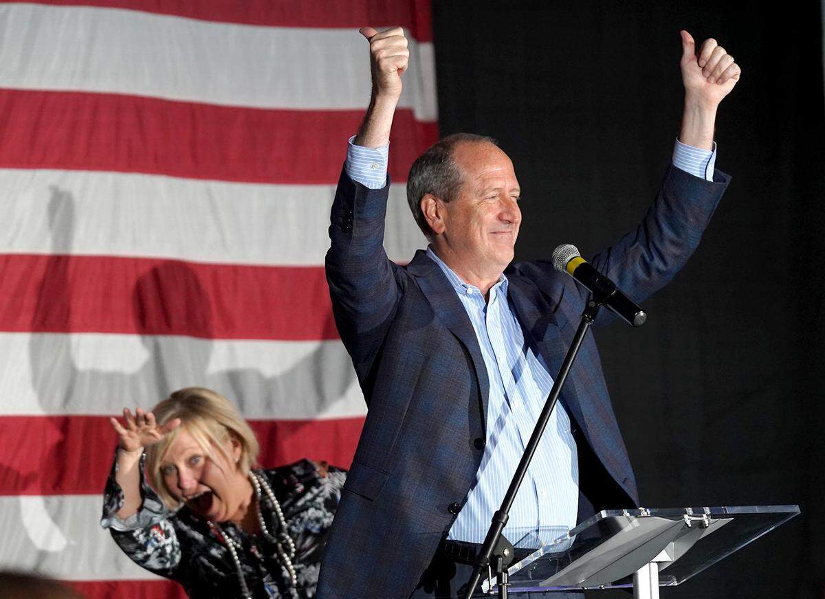 Dan Bishop, left, Republican candidate for the U.S. House ninth district in North Carolina, celebrates his victory over Dan McCready with supporters in Monroe, N.C., on Tuesday, September 10, 2019.