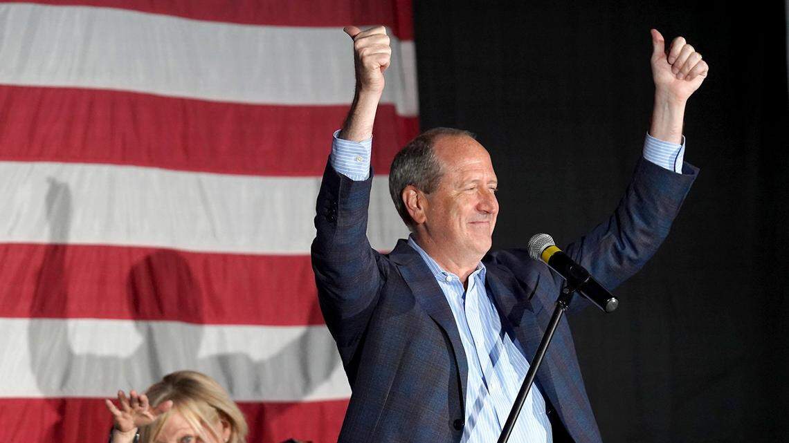 Dan Bishop, left, Republican candidate for the ninth district in North Carolina celebrates his victory over Dan McCready with supporters in Monroe, NC on Tuesday, September 10, 2019.