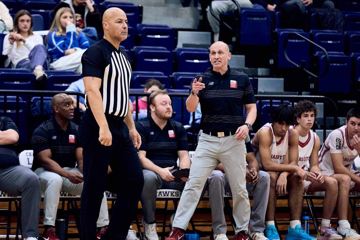 Charlotte Catholic head coach Mike King gets into it with the official after being called for a technical foul in the second half of the 2025 Charlotte Latin Invitational Finals against Charlotte Catholic.