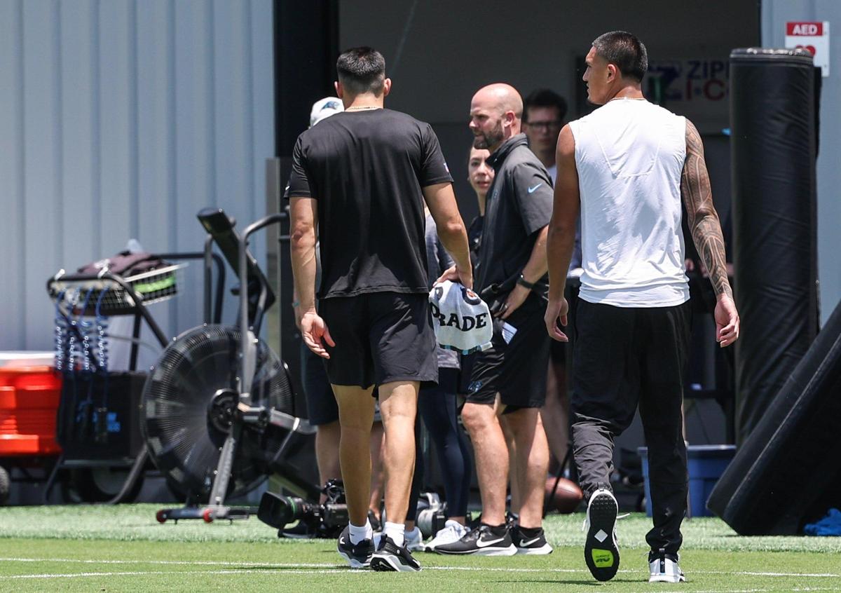Panthers wide receiver Tetairoa McMillan, far right, watches practice from the sideline during the second day of minicamp in Charlotte, NC on Wednesday, June 11, 2025.