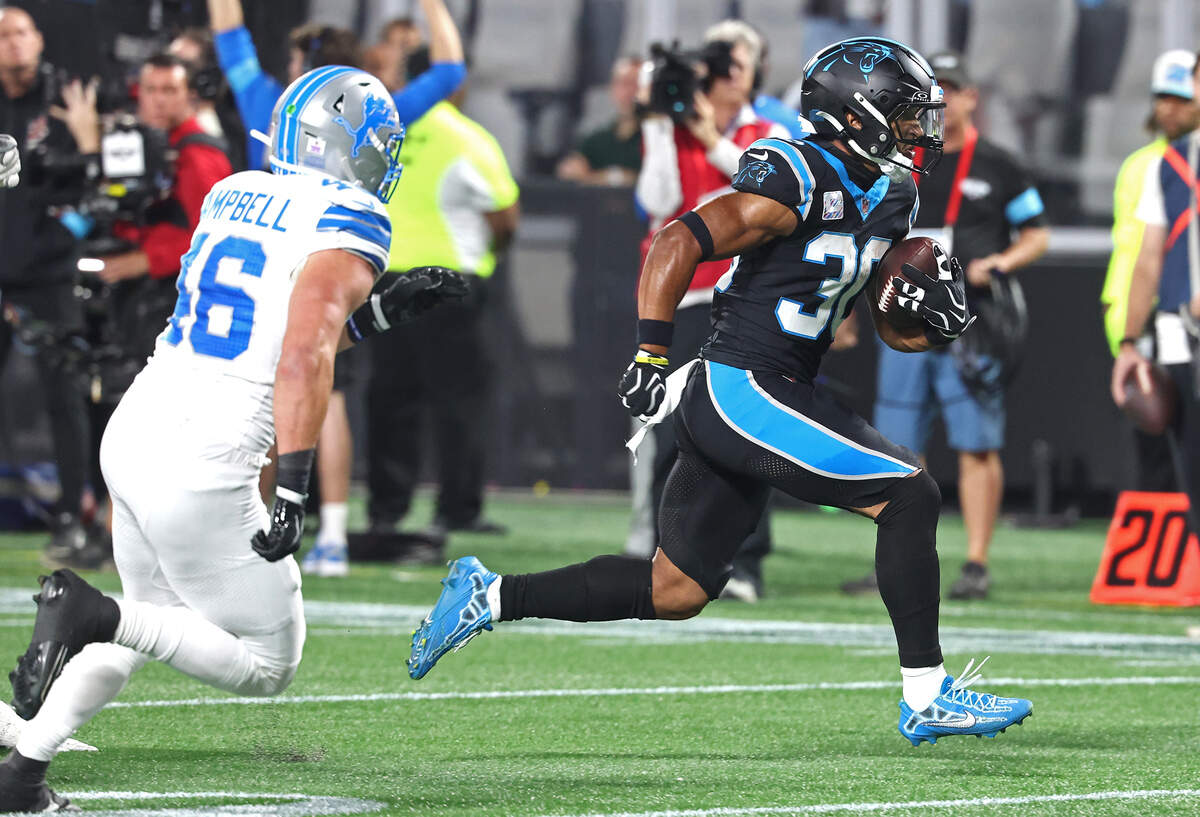 Carolina Panthers running back Chuba Hubbard, right, breaks free from the Detroit Lions defense on a touchdown run during action at Bank of America Stadium in Charlotte, NC on Sunday, October 4, 2026.