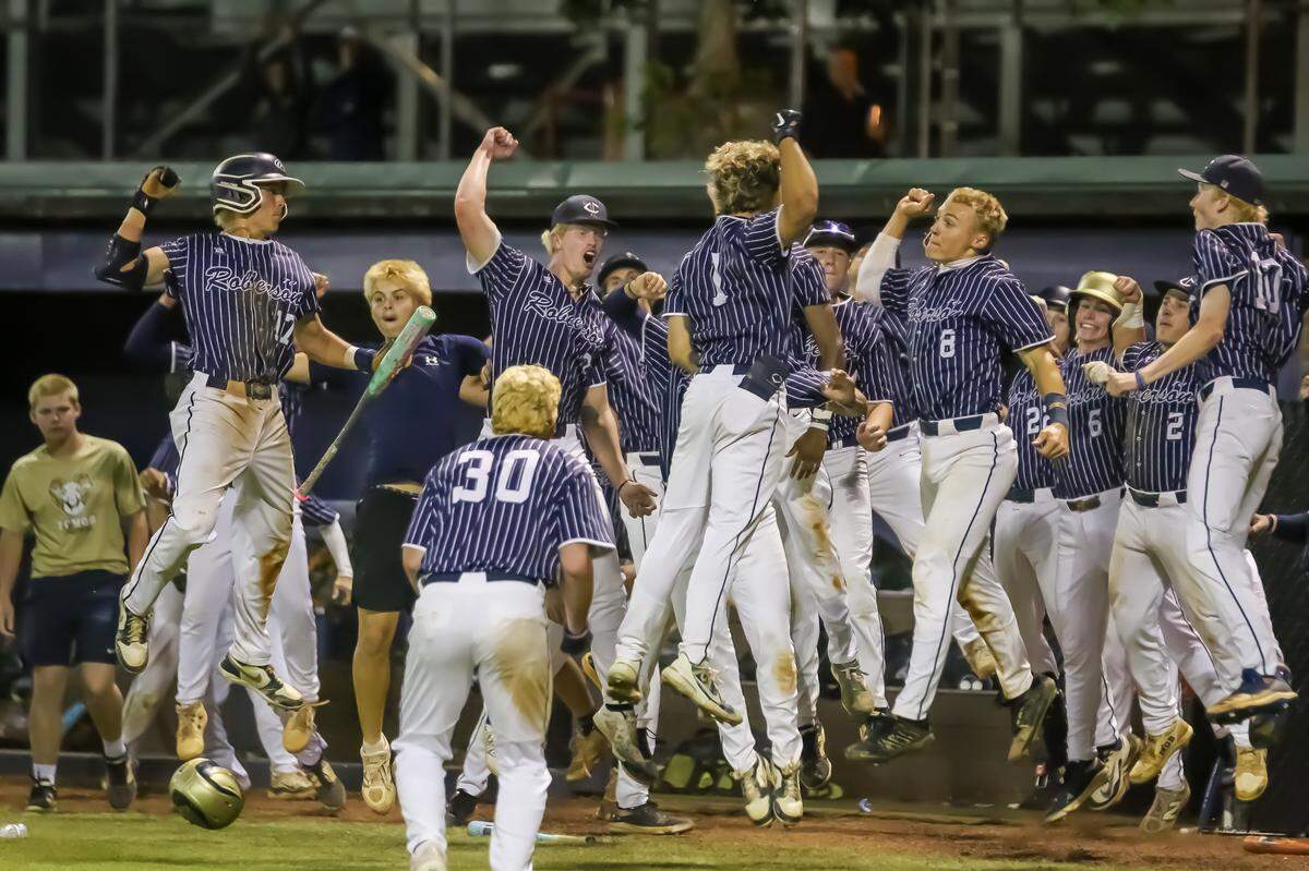 TC Roberson players leap with excitement after taking a commanding lead late during Friday’s NCHSAA 4A Western Regional championship game with Cuthbertson in Waxhaw NC on May 23rd, 2025