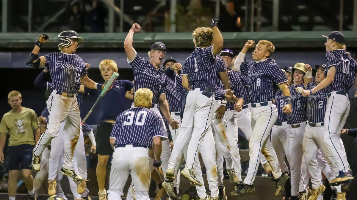 TC Roberson players leap with excitement after taking a commanding lead late during Friday’s NCHSAA 4A Western Regional championship game with Cuthbertson in Waxhaw, N.C., on May 23, 2025.