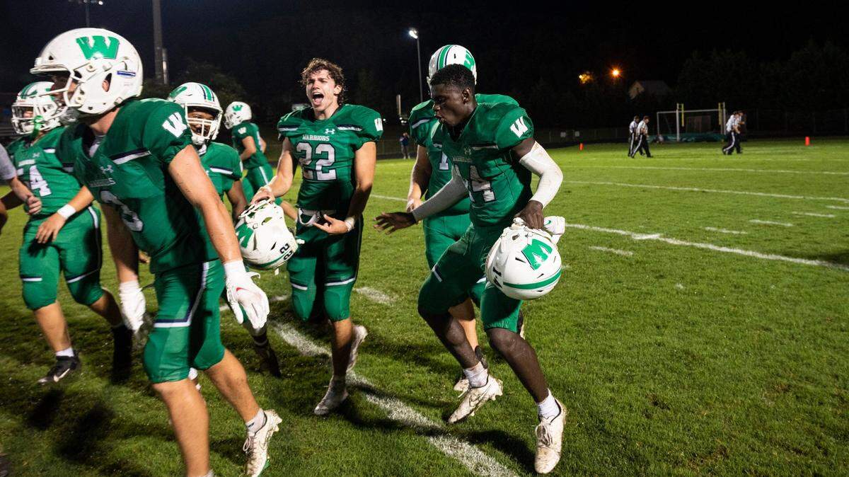Weddington players celebrate their victory over Charlotte Christian High School after the game on Friday, August 20, 2021 in Weddington, NC. Weddington beat Charlotte Christian with a final score of 14-7.