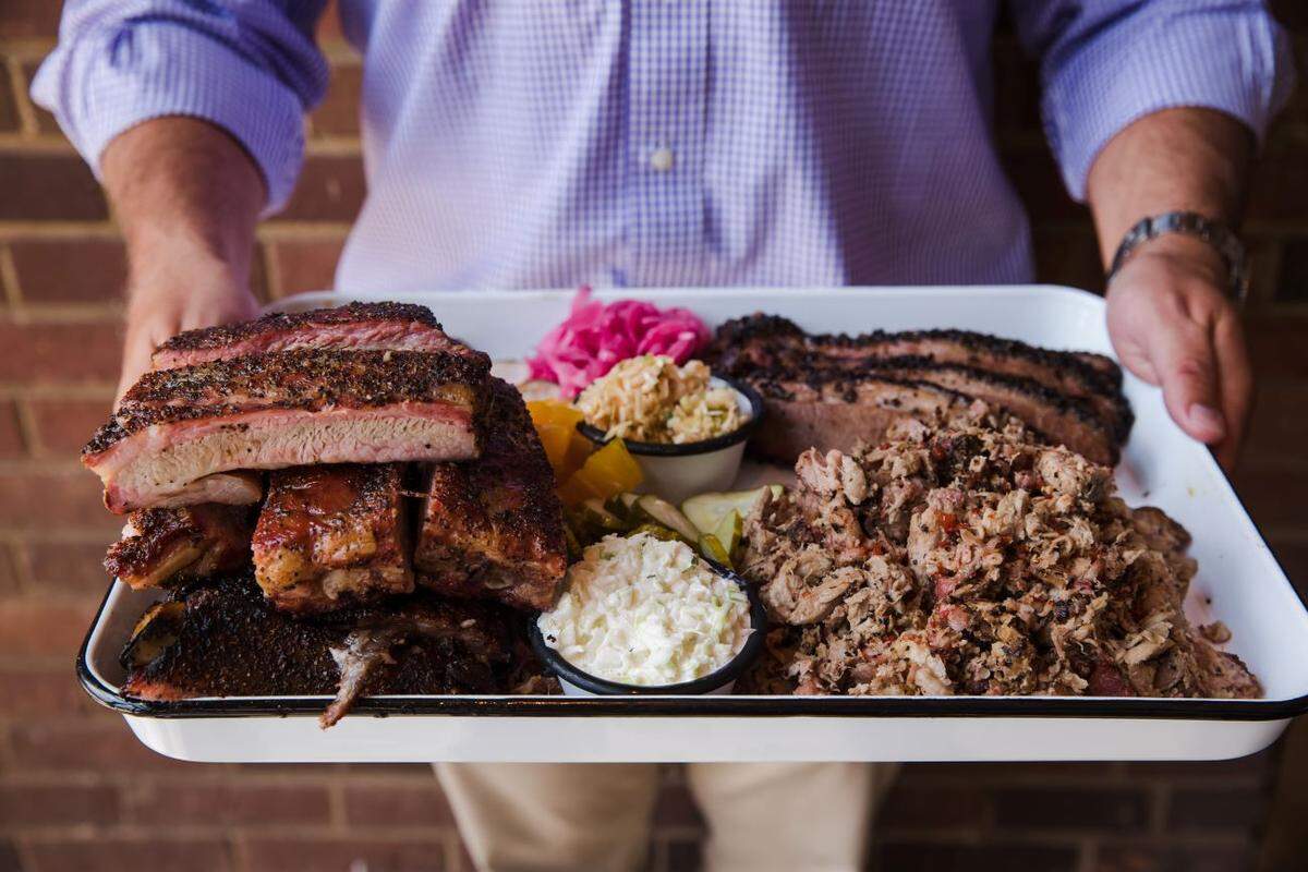 Sometimes, the best gift you can give is food, such as this heaping plate of barbecue favorites from Noble Smoke.