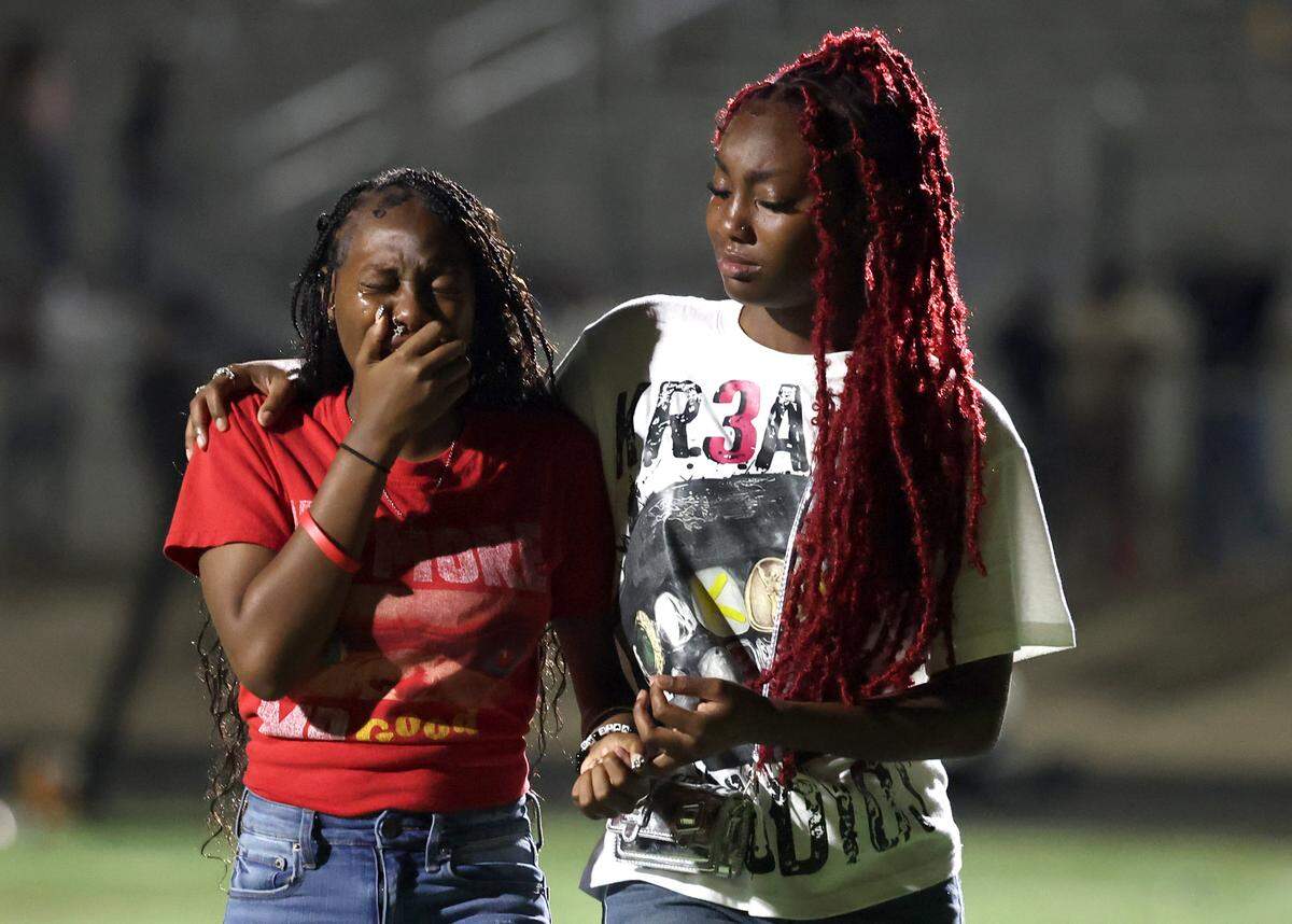 Overcome with emotion, young fans walk across the football field following a chaotic scene that erupted near the 9:19 mark of third quarter action of the West Charlotte vs Mallard Creek football game. The disruption had players and fans scrambling for safety on Friday, September 20, 2024 at West Charlotte High in Charlotte, NC.