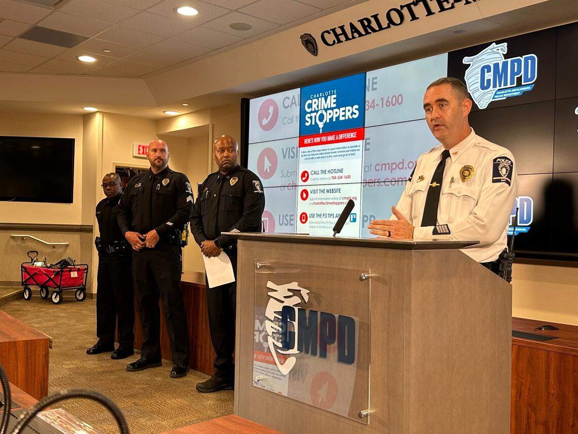 CMPD Deputy Chief Ryan Butler, standing at the lectern, spoke about mid-year crime statistics at a press conference Thursday. Next to him, (from right) are Sgt. Kevin Wiggins, Capt. Michael Carter, and Sgt. Jeffrey Joseph.