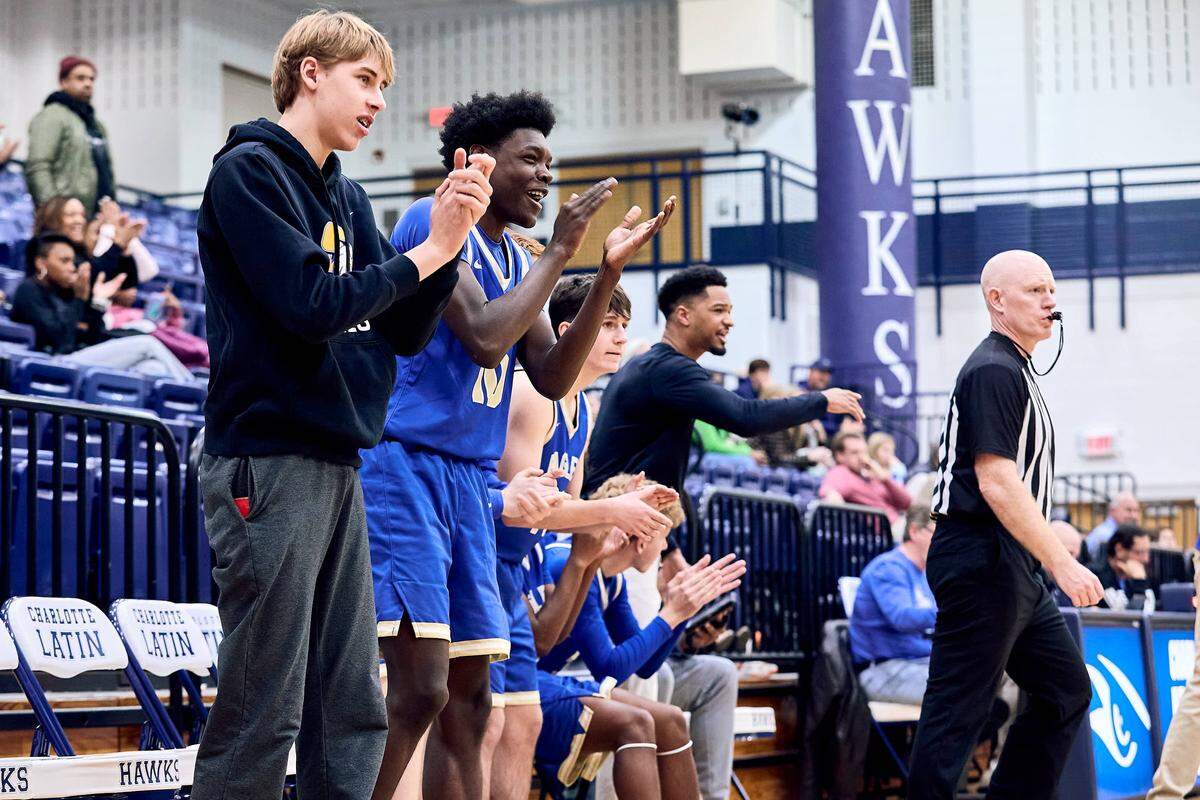 SouthLake Christian bench gets up and cheers on their team in the second half of the 2025 Charlotte Latin Invitational Finals against Charlotte Catholic.