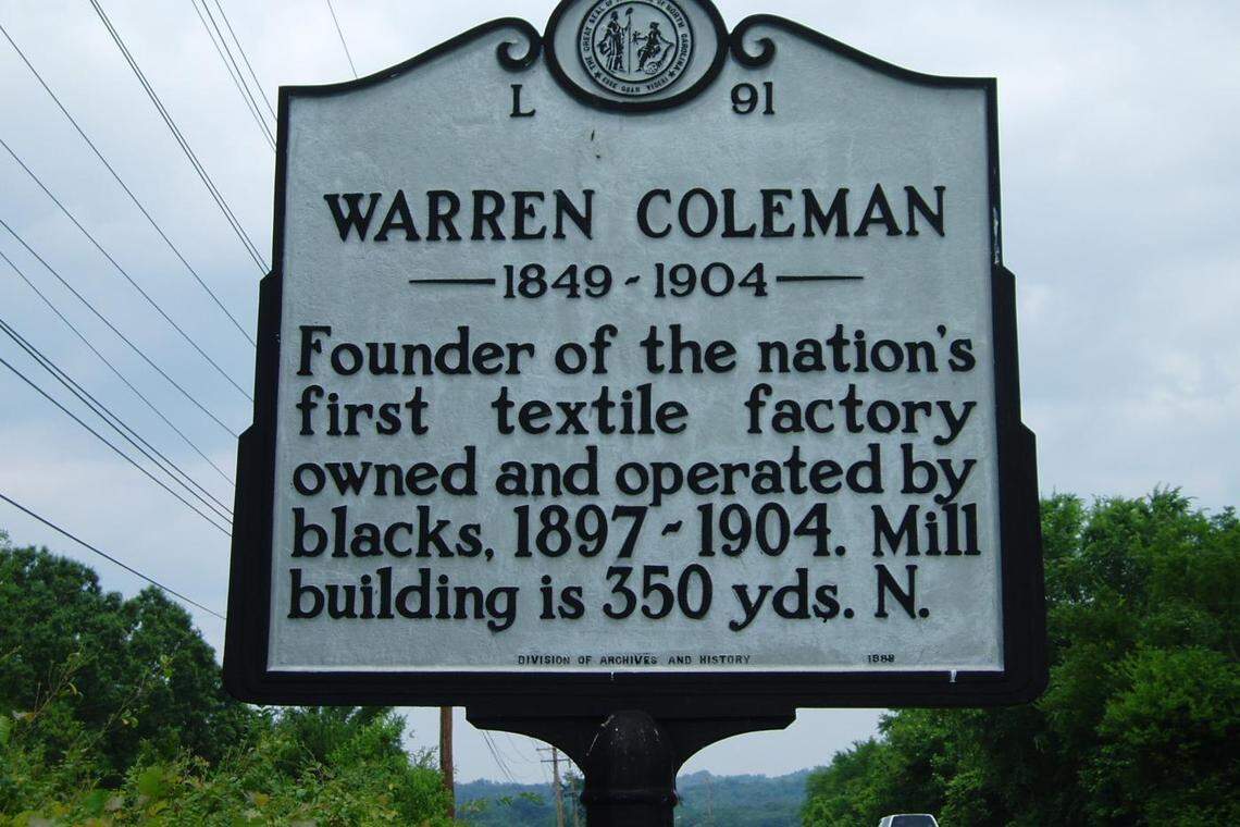 This state historical marker on U.S. 601 Bypass (Warren C. Coleman Boulevard) at Main Street in Concord, honors the founder of the nation’s first Black-owned and -operated textile mill.