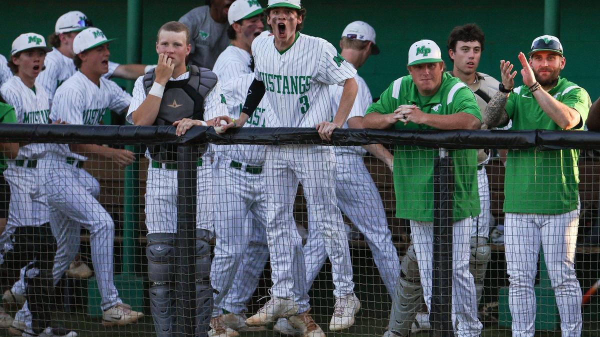 Myers Park’s bullpen gets excited as players round the bases on Tuesday, May 9, 2023 during the first round of the first round of the NCHSAA 4A baseball playoffs against Hough at Myers Park High School.