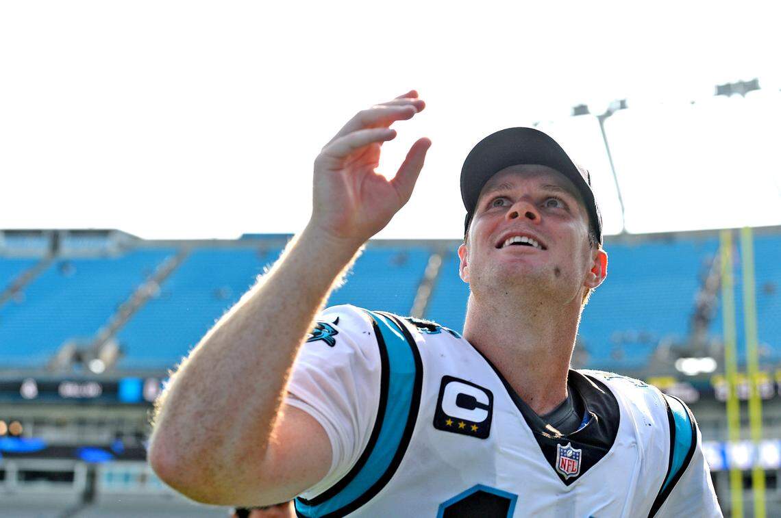 Carolina Panthers quarterback Sam Darnold smiles at the fans after tossing them a souvenir following the teamÕs 19-14 victory over the New York Jets at Bank of America Stadium in Charlotte, NC on Sunday, September 12, 2021.