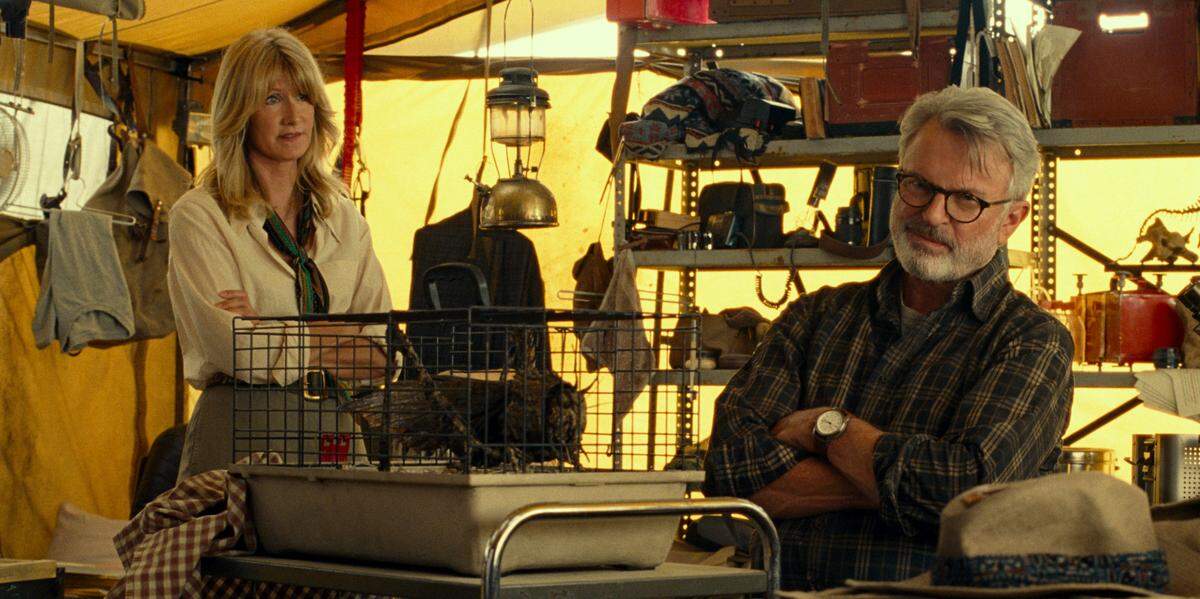 Laura Dern and Sam Neill in a scene from “Jurassic World: Dominion,” one of the blockbuster films driving people back to movie theaters.