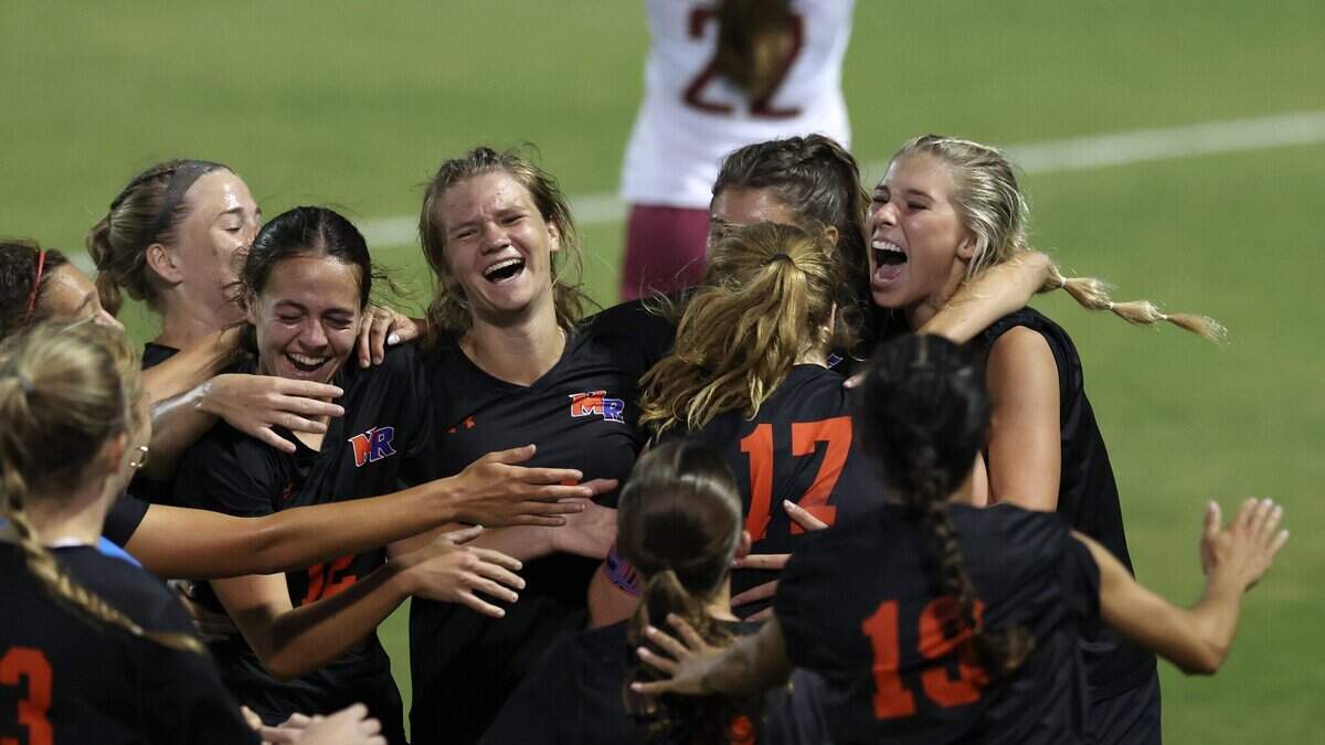 Marvin Ridge celebrates their 2-1 victory over Wilmington Ashley of the NCHSAA 4A state final game at the Matthews Sportsplex in Matthews on Friday, May 31, 2024.