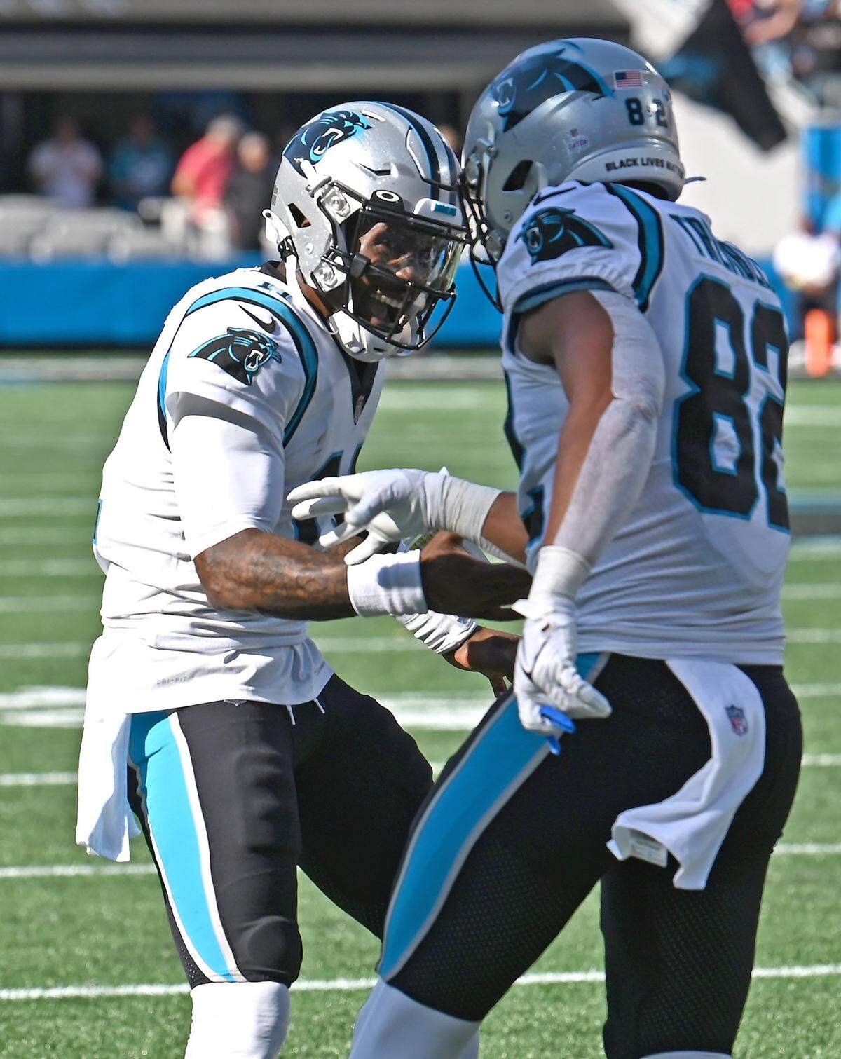 Carolina Panthers quarterback PJ Walker, left, runs to congratulate tight end Tommy Tremble, right, on his touchdown pass reception during second half action against the Tampa Bay Buccaneers at Bank of America Stadium in Charlotte, NC on Sunday, October 23, 2022. The Panthers defeated the Buccaneers 21-3.