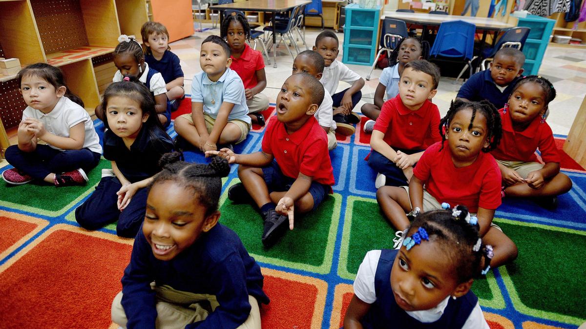 Children listen in a public pre-K class at Smart Kids No. 1  in Charlotte.