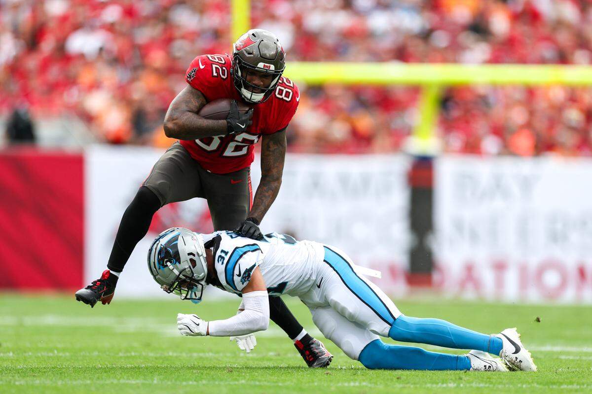 Tampa Bay Buccaneers tight end Devin Culp (82) holds off Carolina Panthers cornerback Caleb Farley (31) in the first quarter at Raymond James Stadium in Tampa, Fl. on Sunday Dec 29, 2024