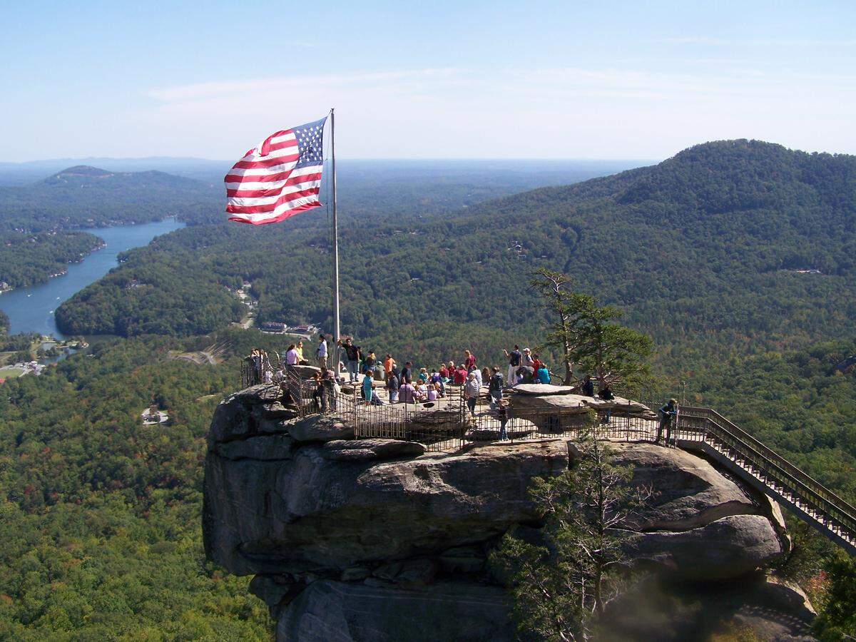 This popular view of Chimney Rock, and Lake Lure behind it, is seen from the Opera Box, a nearby vantage point.