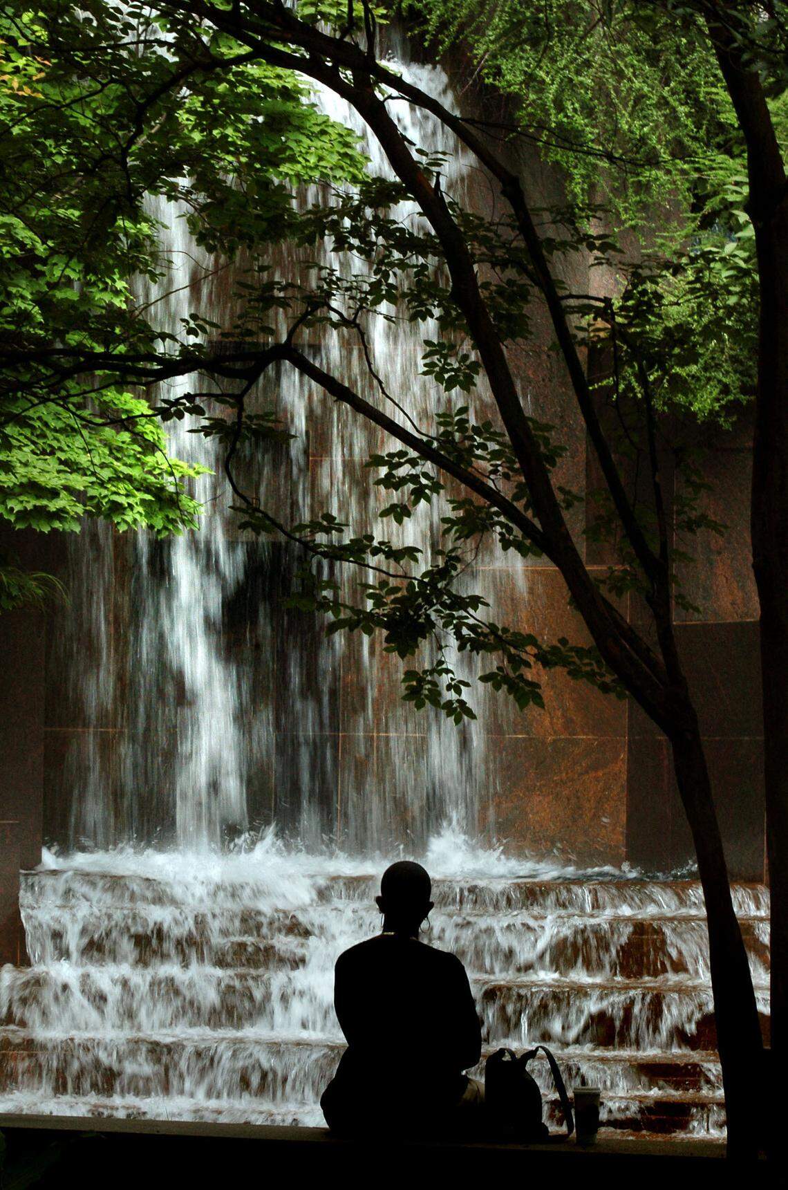 7/1/2004 Cascading waters at the Thomas Polk Park fountain at The Square in uptown Charlotte offer a serene retreat for lunch-time visitors. TODD SUMLIN-STAFF PHOTO