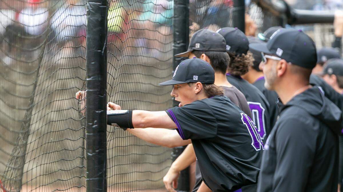 Ardrey Kell players cheer on their team from the sidelines