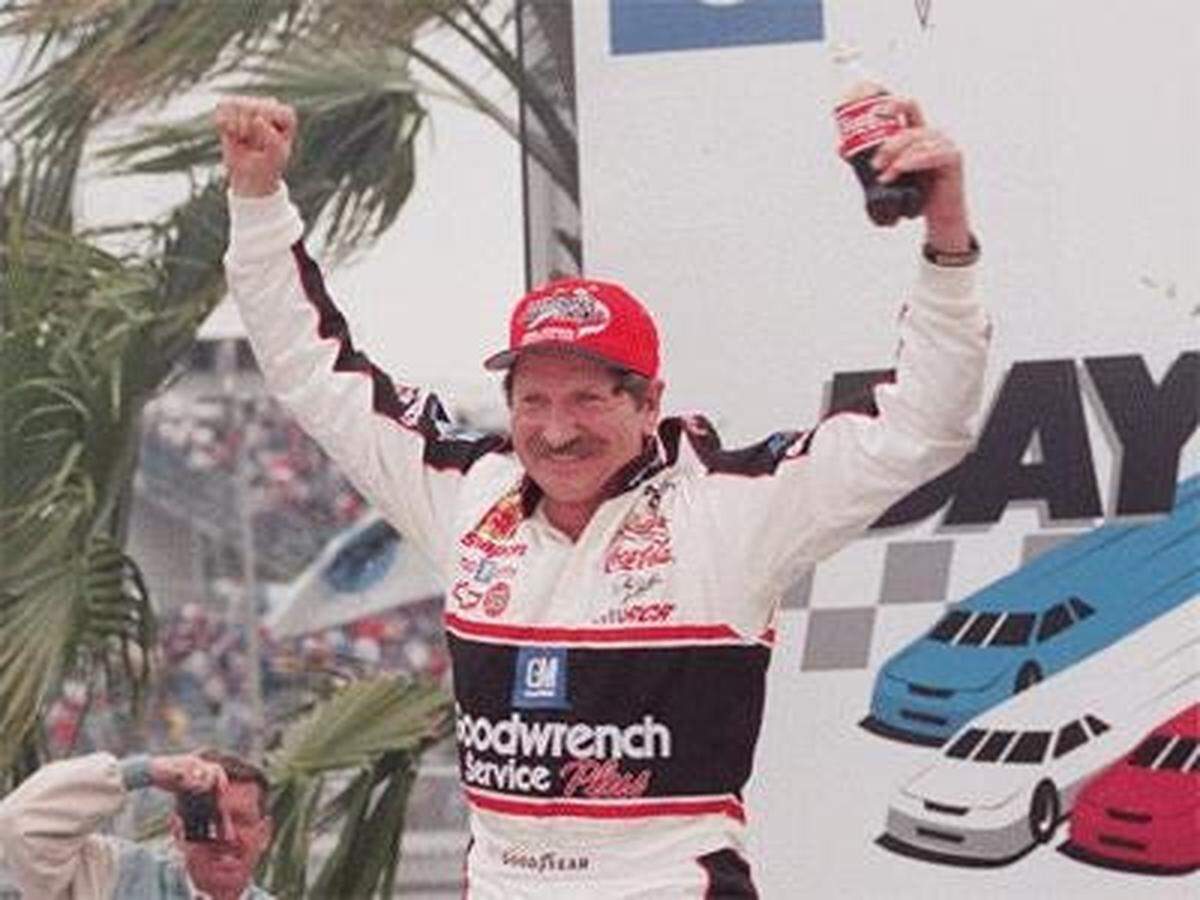 Dale Earnhardt celebrates winning the Daytona 500, finally in 1998. In his 20th Daytona 500 start, champagne finally poured over the Man in Black as he went to Victory Lane as the champion. Earnhardt drove a dominant car as he led five times for 105 laps. He took the lead for good on Lap 140 and was out front when the caution flag flew over the final lap. He also won a Duel, was fourth in IROC and came back in the summer to finish 10th in the 400.
